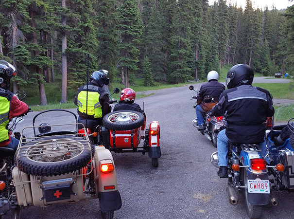 Rocky Mountain Sidecar Adventure tour group on a beautiful scenic road outside of Calgary