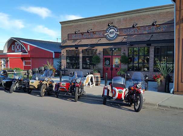 Rocky Mountain Sidecar Adventure High Spirits Adventure Tour bikes parked in front of Eau Claire Distillery