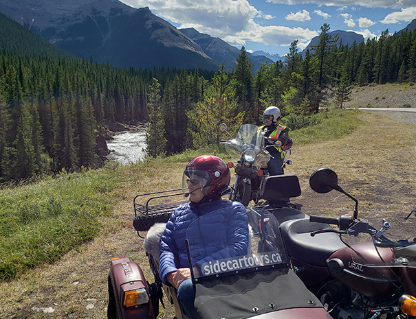 Rocky Mountain Sidecar Adventures Foothills Tour group looking out at the beautiful mountain views