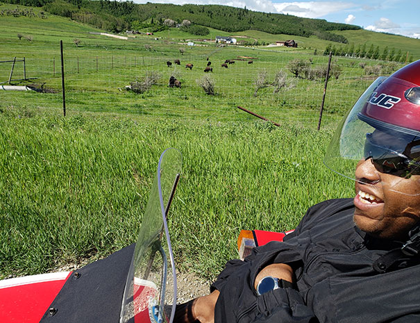 Rocky Mountain Sidecar Adventures customer enjoying the views in the Foothills