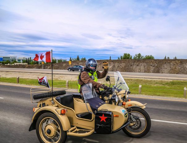 Rocky Mountain Sidecar Adventure's Owner Warren on the open road with his bike and sidecar